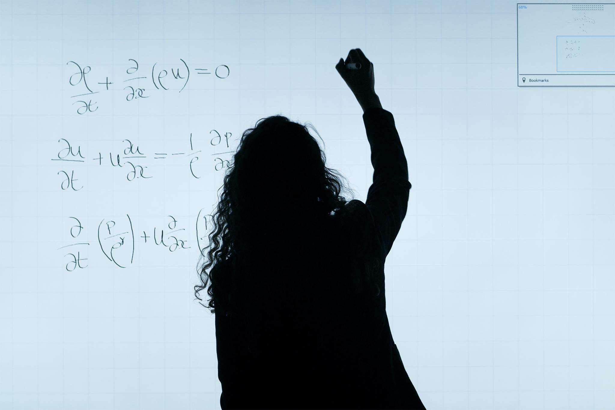 decorative - writing out a math problem on a smartboard