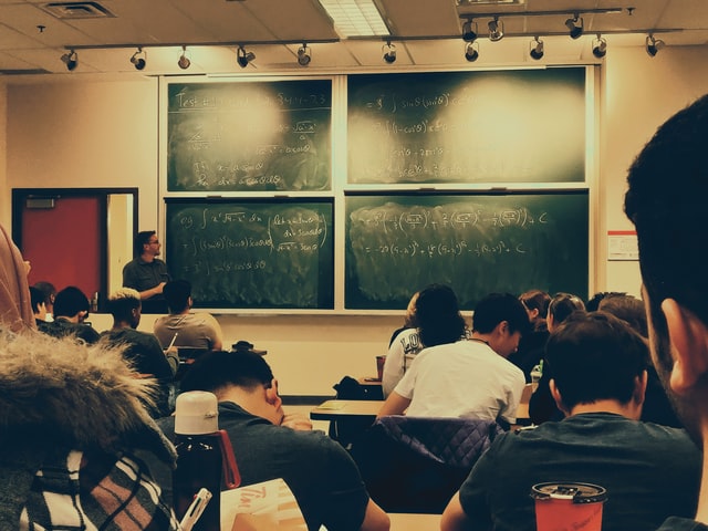 students attending an in-person lecture