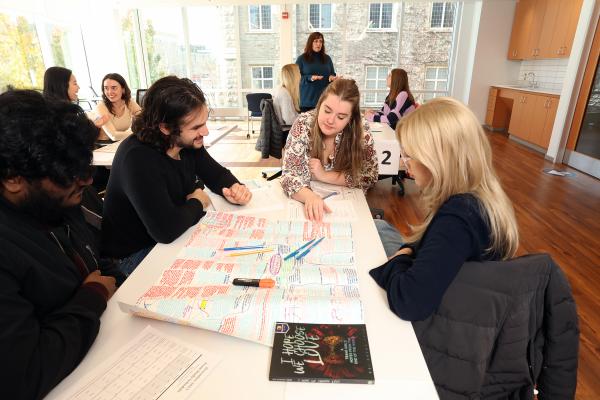 Students discuss a text at Write It