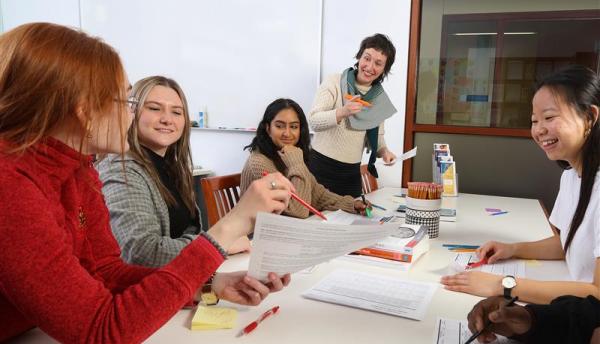 students sitting around a table talking