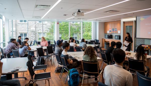 students at desks watching a presentation