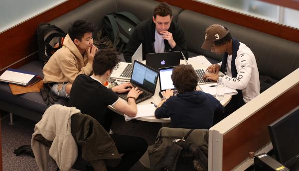 Group of students having a study session and brainstorming together.