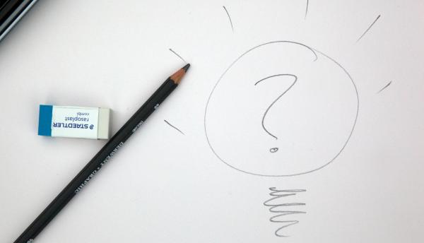 Pencil and eraser, with a written question mark