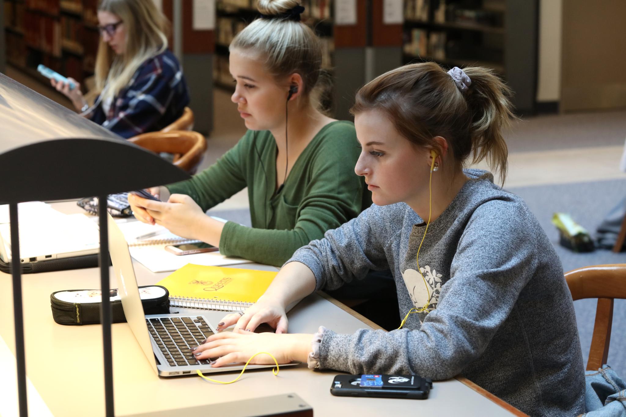 students working at a table in Stauffer Library