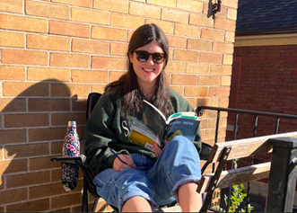 "Emma reading in the sun"